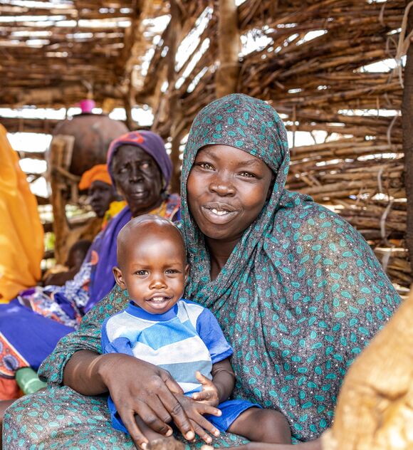 Saida Salima, 28yrs, a mother brought her malnourished child to malnutrition clinic in Thobo county. Saida depends on farming but due to lack of rains last year, Saida and family ran out of  food and have nothing to feed on, they have been surviving on nutritionally inadequate leaves and roots that have led to malnourishment of her child. She has received plumpy nuts to feed her child. The clinic is being run by Trocaire.